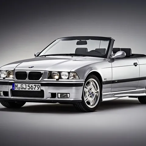 Silver BMW E36 M3 Convertible with the top down, studio shot