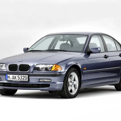 Grey BMW E46 3 Series four-door saloon, studio front three-quarter shot