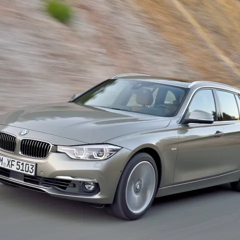 Platinum silver BMW F31 3 Series Touring driving, front three-quarter view
