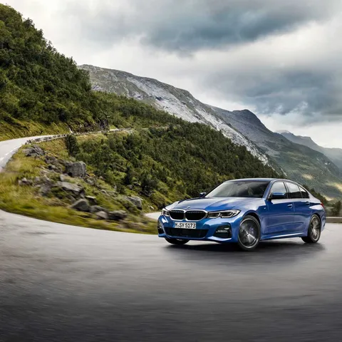 Portimao Blue BMW G20 3 Series M Sport saloon on a mountain road