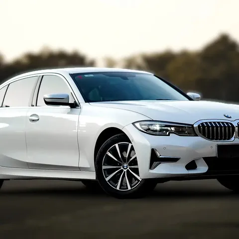 White BMW 3 Series Gran Limousine long-wheelbase saloon, front three-quarter view
